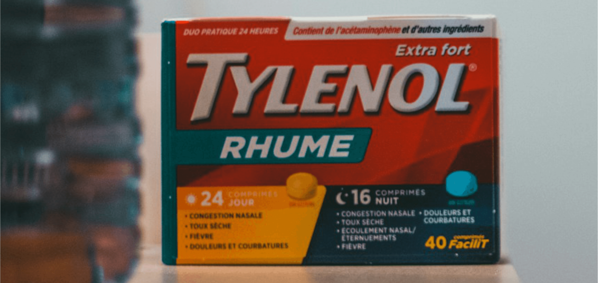 Tylenol Pregnant woman holding Tylenol bottle with warning label highlighting developmental risks